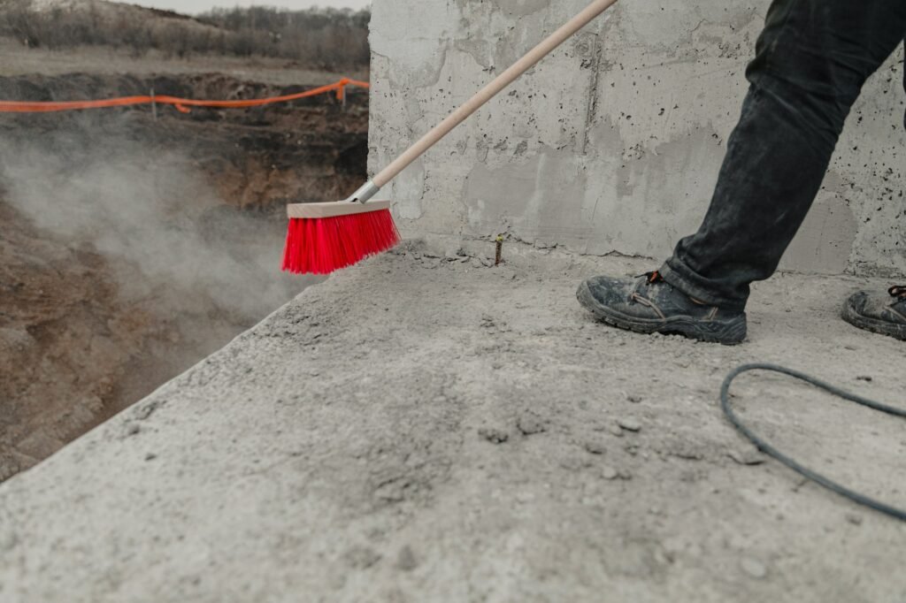 Closeup shot of a cleaning brush being used at the construction process