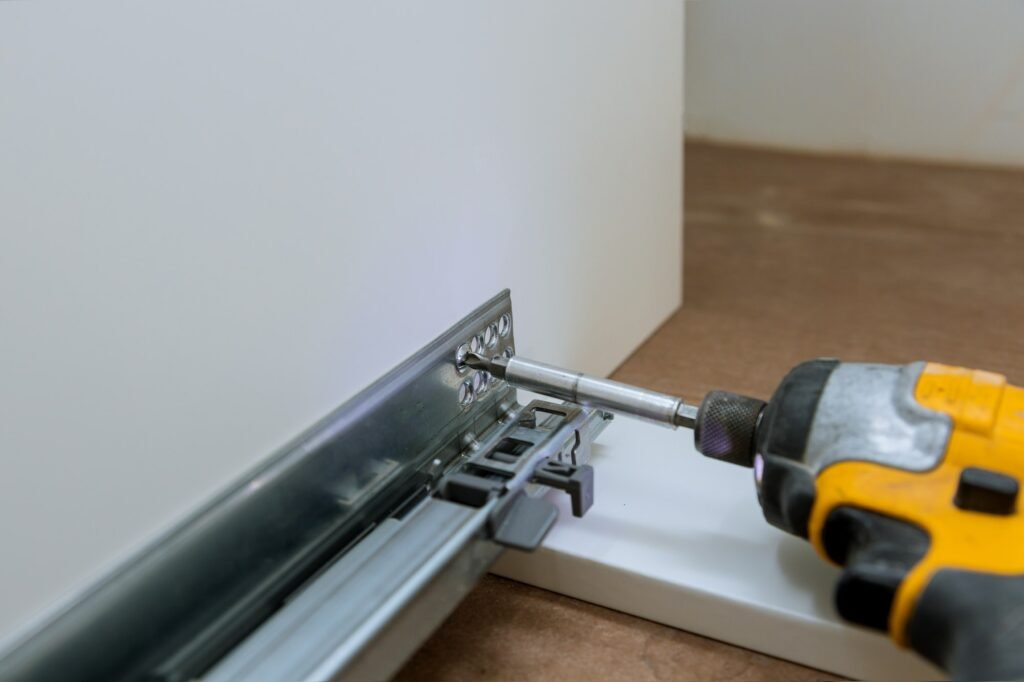 Hinge drawers on assembling a kitchen cabinet furniture